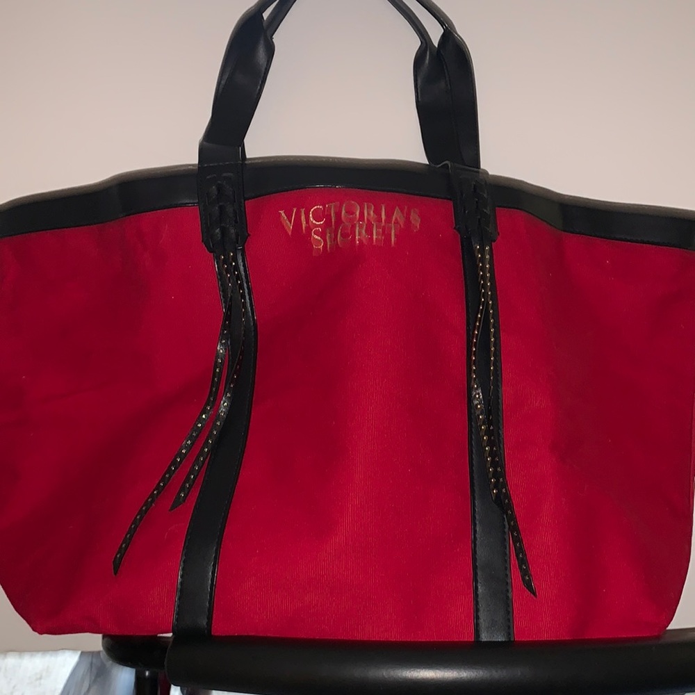 Large like-new red Victoria Secret ‘love, Victoria’ brand black lined tote.